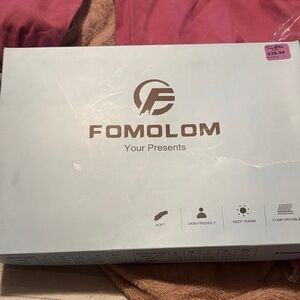 Fomolom under clothes or pajamas never worn still with tags!